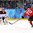 SOCHI, RUSSIA - FEBRUARY 12: Switzerland's Denis Hollenstein #70 fires a shot against Latvia's Edgars Masalskis #31 during men's preliminary round action at the Sochi 2014 Olympic Winter Games. (Photo by Andre Ringuette/HHOF-IIHF Images)